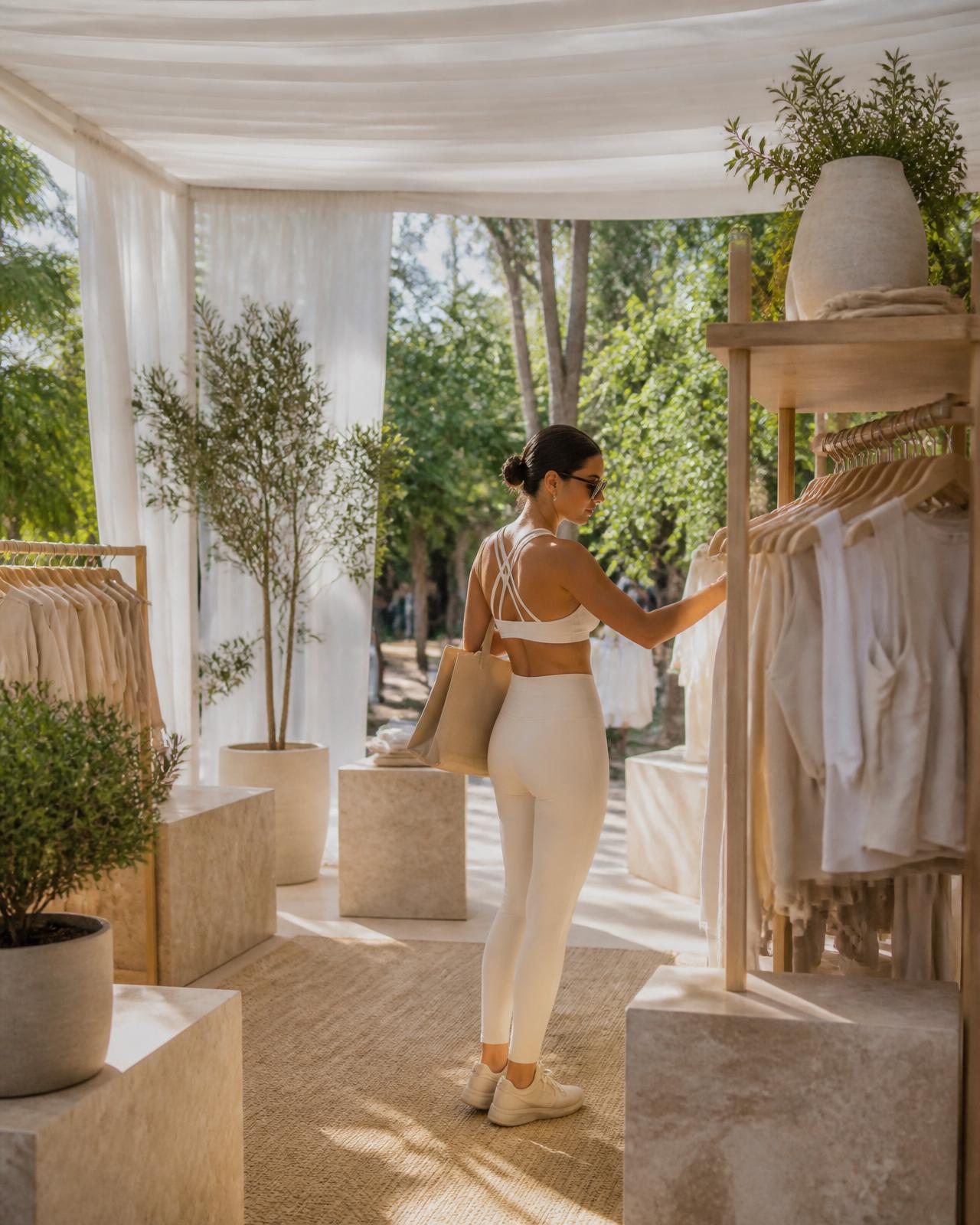 Outdoor AYLA pop-up activation under a linen canopy